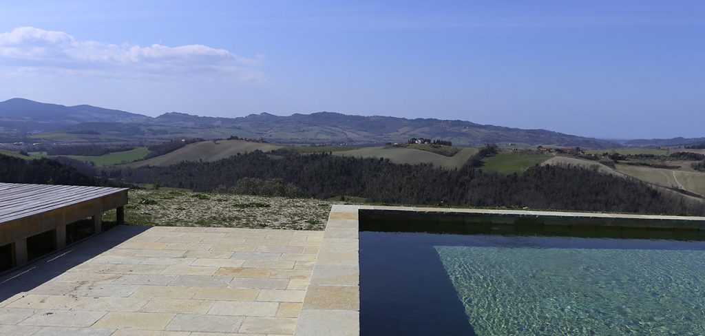 Case di Gello pool in the Tuscan landscape