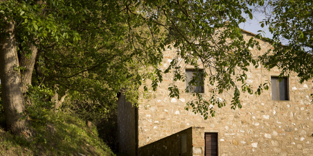 Casa delle Acque — exterior with cypress trees